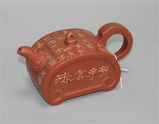 A Chinese Yixing ruyi head shaped teapot, with slip decoration, L. 17.5cm